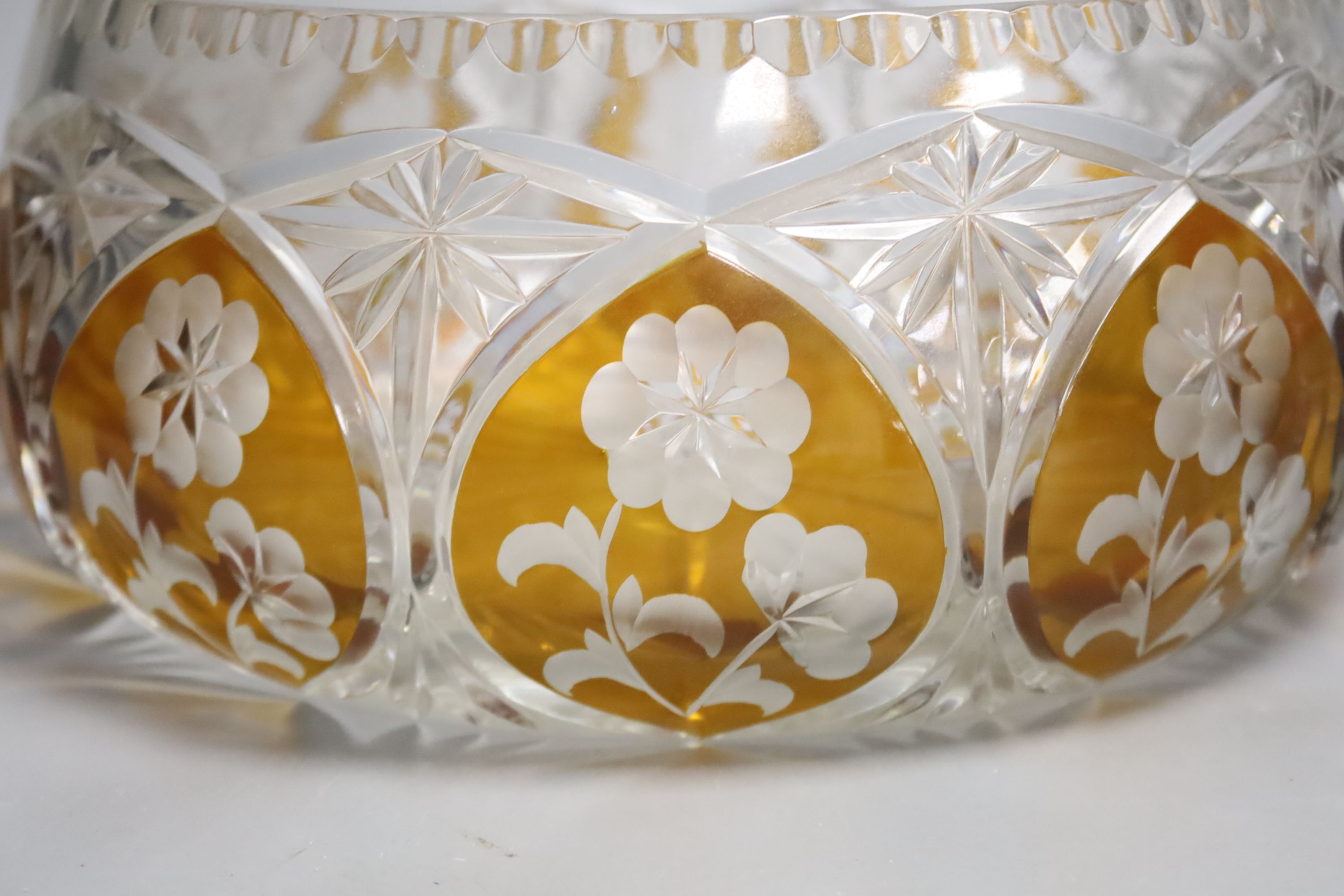 A small collection of cut and moulded glassware including a Murano amber flash cut fruit bowl